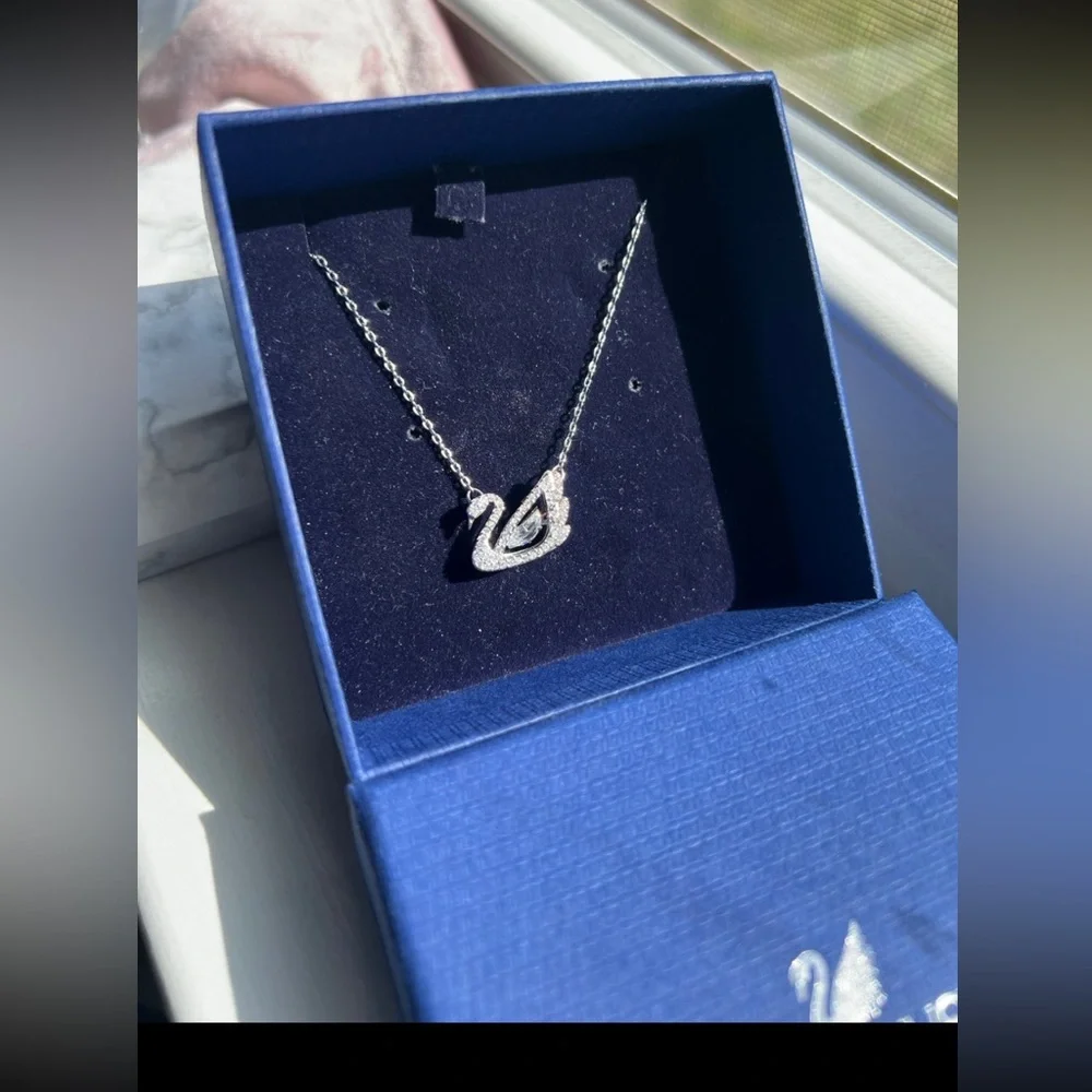 - Swan necklace white rhodium plated from swarovski